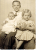 Carson holding siblings Jane and Dewey Mort