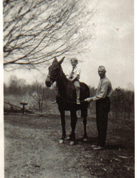 Carson on horse with Grandpop Simon Mort in Perry County